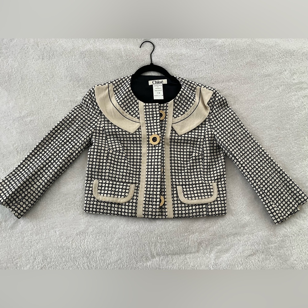 Chloe white and black women’s blazer, euro size T38 which is small.